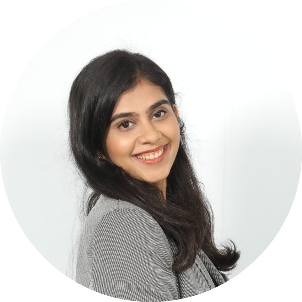 Pritika Nayak smiling in a grey blazer